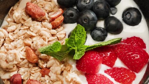 Yogurt Milk with Granola and Fruits Cereals a Nd Berries Healthy Breakfast in Cafe Chef Serving Food