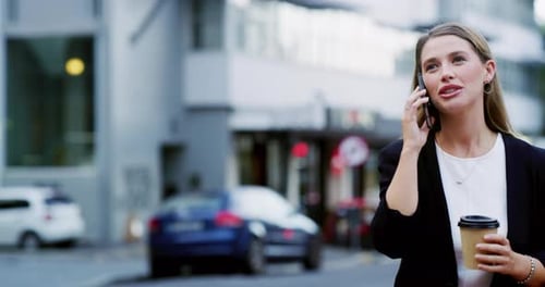 4k video footage of a well dressed corporate businesswoman making a phonecall while in the city