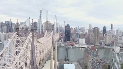 Cinematic 4K Aerial orbit of Queensboro Bridge NYC east river