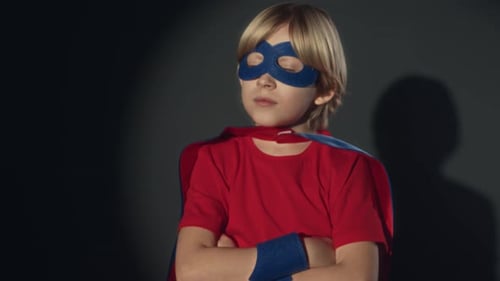 Boy Wearing Superhero Costume Posing in Studio
