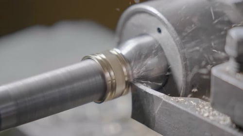 Automated Lathe Cuts Metal Splintering