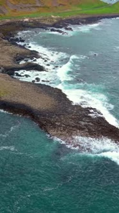 High and wide social ratio aerial video of The Giant's Causeway in Bushmills, Northern Ireland