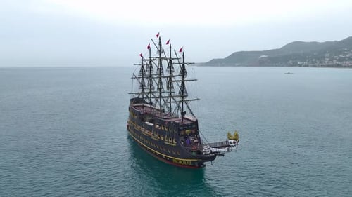 Black Pirate Ship Sailing on Open Sea
