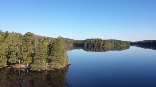 View over a lake shoot from a drone.