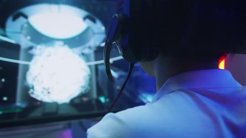 Close-up Shot of Professional Gamer Playing in First-Person Shooter Online Video Game on His Person