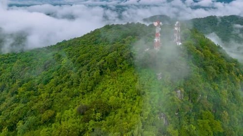 Mist flowing over the summit Above is a telecommunications station.