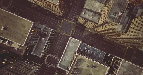 Aerial Flyover Above Modern City Streets and Buildings