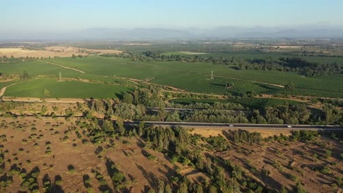 Highway runs between the fields countryside in Chile