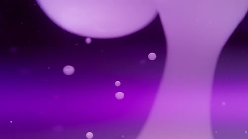 Abstract lava bubbles floating in liquid on a purple background