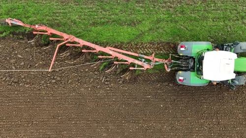 Aerial view of tractor ploughing in Brandenburg, Germany.