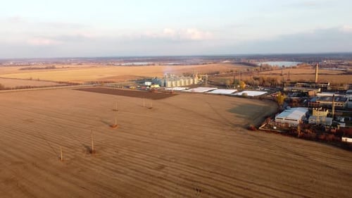 Panoramic View of Yellow Dry Wheat Field After Harvest Grain Elevator