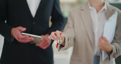 Real Estate Agent Holding Keys Symbol of Dream House