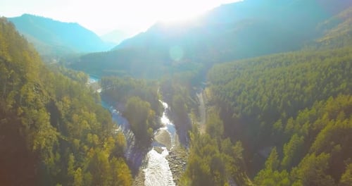 Low Altitude Flight Over Fresh Fast Mountain River with Rocks at Sunny Summer Morning