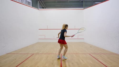 Lady Improves Physical Shape Moving Actively on Squash Court