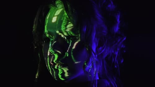 Portrait of a Woman with Green Digital Code Projection on Her Face