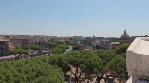 Old Roma cityscape with the landmark Colosseum. Panning shot