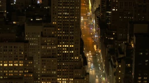 aerial view of illuminated city streets at night. traffic lights. avenue
