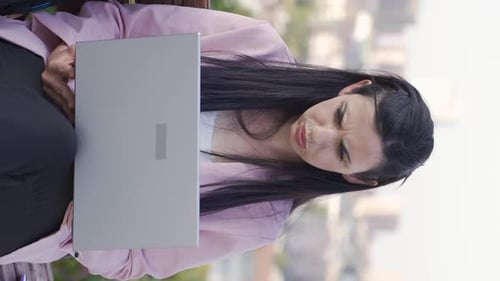 Woman Working Outside Frustrated on Laptop