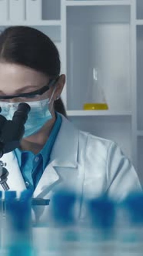 Female Scientist Works in Brightly Lit Laboratory