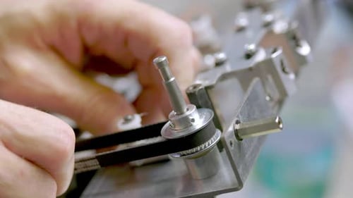 Testing a belt on a small pulley by
hand