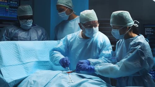 Surgeons Performing Operation in Hospital Operating Room