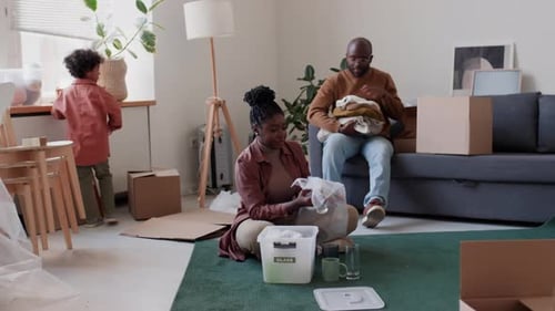 African American Family Packing Belongings before Moving