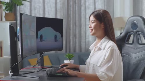 Side View Of Asian Female Automotive Designer Working On 3D Model Of Ev Car On The Computer