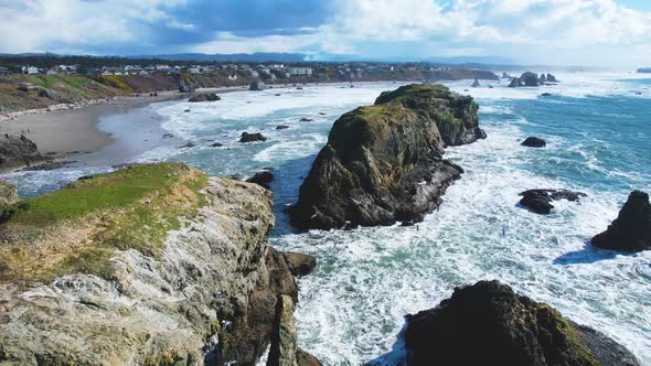 Beautiful 4K aerial drone shot moving quickly over rocks at Bandon ...