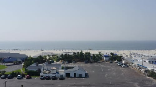 Pedestal shot of the Sands Beach Club along the shore of Long Beach in LI