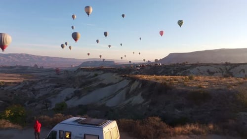 Goreme, Turkey - 01 December 2024: Aerial view of hot air balloons over love valley, Turkey.