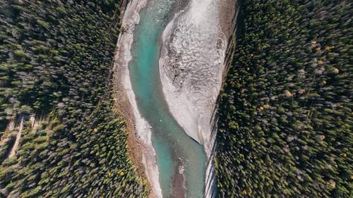 A drone view of the river in the mountains valley. An aerial view of river.