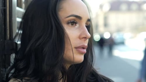 Sad, Unhappy Beautiful Woman Standing by Building in City 20s