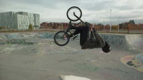 Young Adult Doing Tricks on BMX Bike