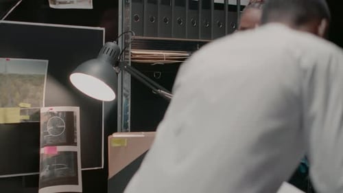 Two Colleagues Reviewing Case Files in the Office