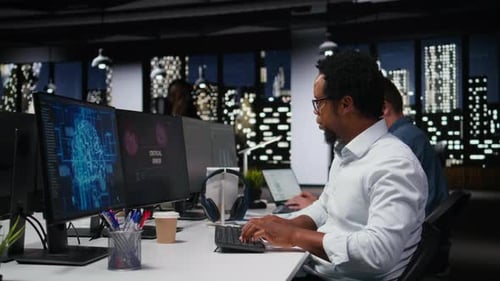 Engineer in Office Receiving Critical Error Warning While Writing Code