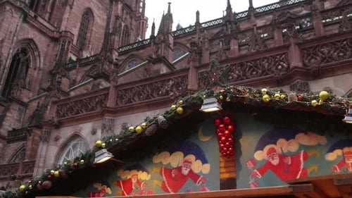 colorful xmas market stall in front of Strasbourg Cathedral at a Festive Christmas market in Europe
