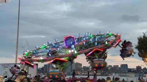 Amusement Park Roller Coaster and Ferris Wheel at Sunset in Dartmouth Canada