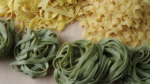 Variety of Fresh Pasta on Cutting Board