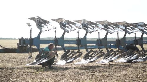 Tractors plowing the field in Ukraine