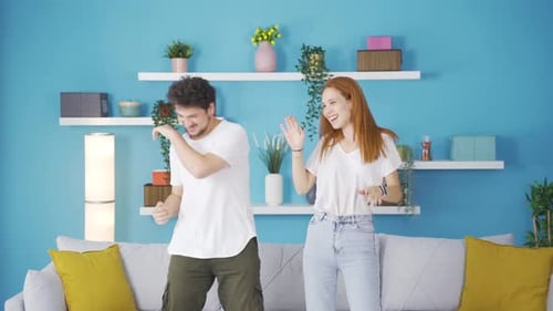 Couple dancing in a fun way.