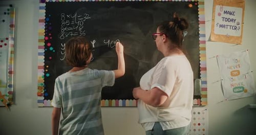 Student Learns Math with Teacher in Classroom