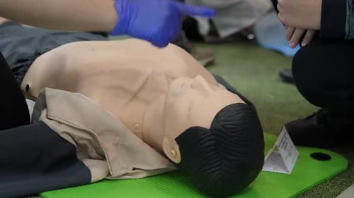 CPR training on medical mannequin in hospital