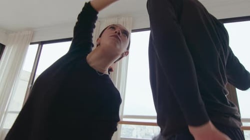 Young Talented Couple Choreographing Contemporary Dance in Studio