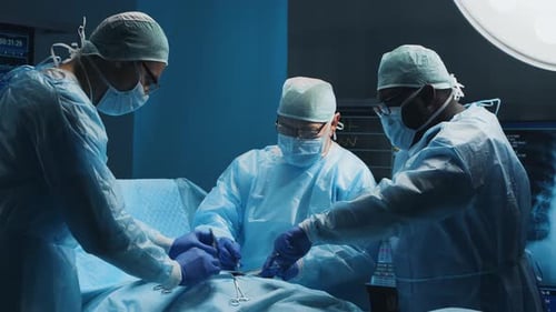 Medical Team Performing Surgery in Operating Room