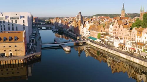 Drone Flies Over Pedestrian Bridge on Gdansk Canal