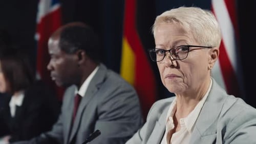 Portrait of Grim Caucasian Female Politician at International Crisis Summit