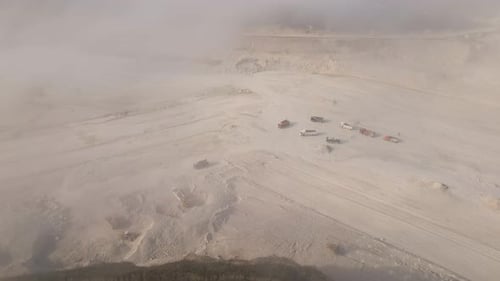 Aerial View of Open Pit Mining of Limestone Materials for Construction Industry with Excavators and