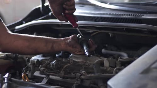Mechanic Repairing Car Engine Close Up Shot