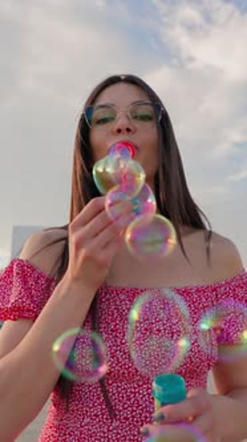 Portrait Happy Brunette Woman Wearing Glasses Blowing Soap Bubbles