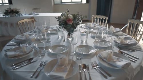 Elegant Wedding Table Setting with Floral Decorations